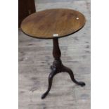 19th Century mahogany snap top tripod table with turned column and pad feet.