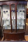 Mahogany double glazed door display cabinet with double cupboard below raised on ball and claw feet,