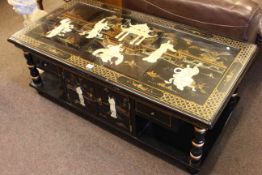 Oriental black lacquered coffee table decorated with figures in garden temple, modern.