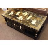 Oriental black lacquered coffee table decorated with figures in garden temple, modern.
