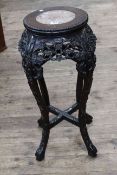 Oriental circular carved hardwood and marble inset top jardiniere stand, 68cm by 28cm diameter.