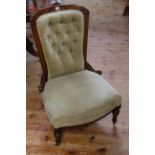 Victorian walnut framed button back nursing chair on turned reeded legs,