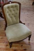 Victorian walnut framed button back nursing chair on turned reeded legs,