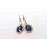 Pair of 14 carat yellow gold, sapphire and diamond earrings, 2.29 carat sapphires and 0.