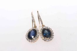 Pair of 14 carat yellow gold, sapphire and diamond earrings, 2.29 carat sapphires and 0.