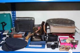 Hacker radio, portable typewriter, Hilkinson cased binoculars, three brollies, bookends, seashells,