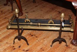 Small brass fender, small pair of brass fire dogs and pair of wrought iron and brass andirons.