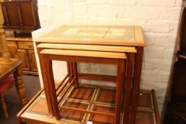 Danish teak and tiled top nest of three tables, largest 48cm by 56cm by 41cm,