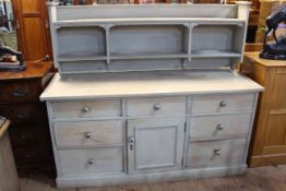 Antique stripped pine seven drawer dresser and rack, the rack adapted to be wall mounted,