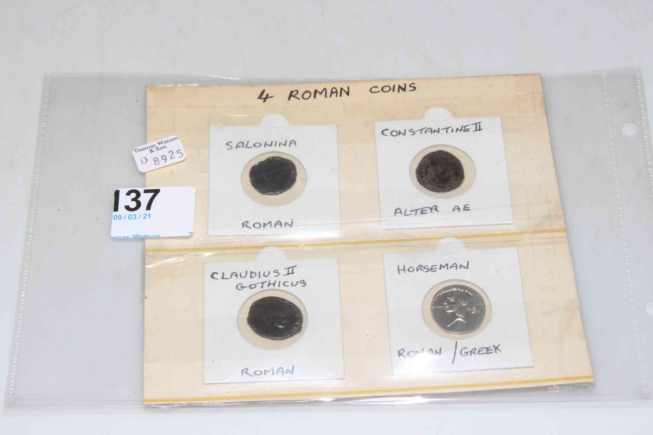 Four Roman coins.