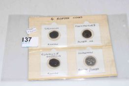 Four Roman coins.