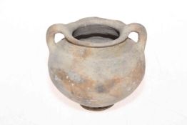 Ancient (Roman?) two handled pottery vessel, 11cm high.