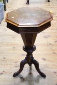 Victorian walnut octagonal sewing table on tapering pedestal to tripod base, 71cm.