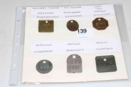 Six colliery/pit check tokens.