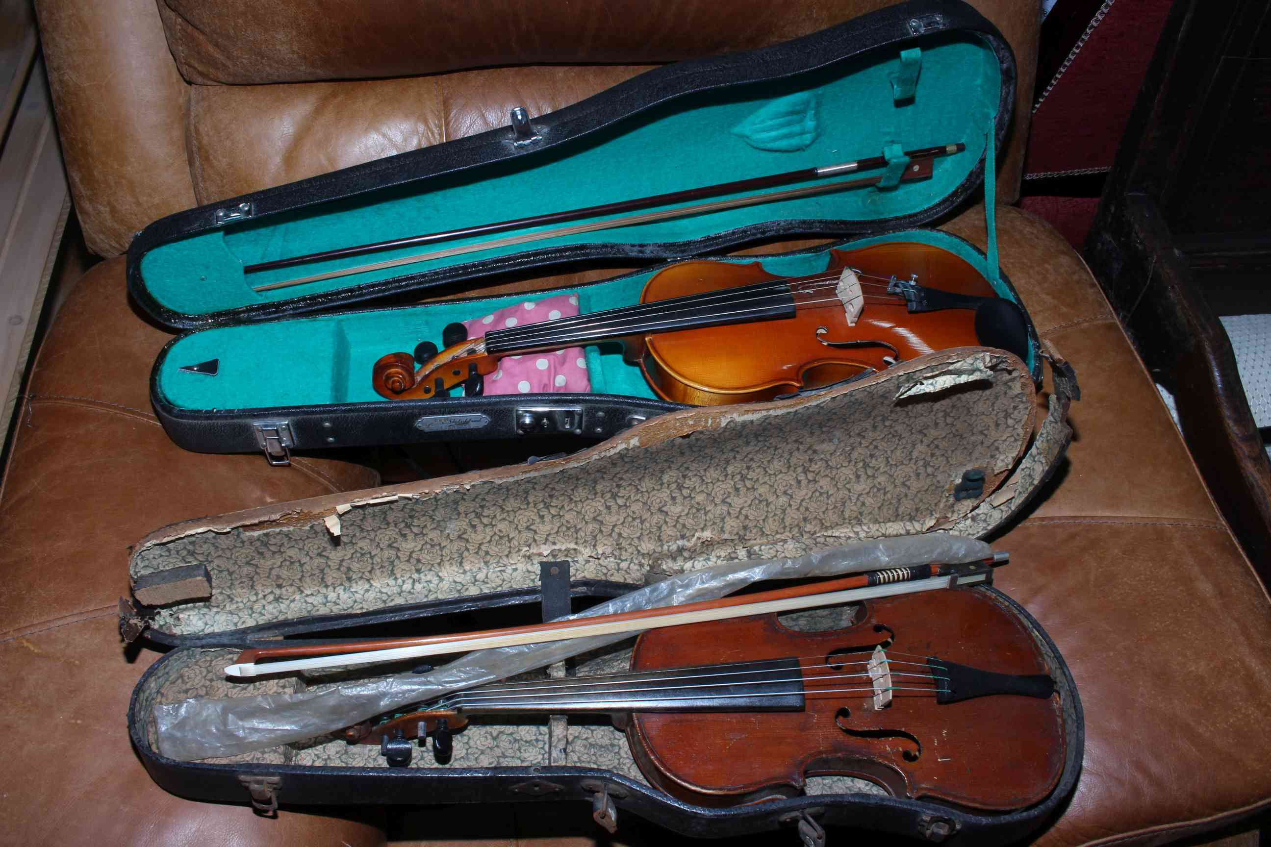 Two cased violins with bows (one 3/4 size). Condition: 3/4 violin in fairly poor condition.