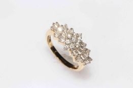 18 carat yellow gold and diamond ballerina cluster ring having thirty five brilliant and baguette