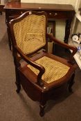 Mahogany framed bergere panel back and seated commode armchair.