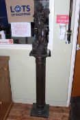 Composite bronze model of a maiden holding and kissing doves on a corinthian column stand,