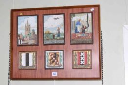 Collection of six Dutch ceramic tiles framed as one, 45cm by 57cm overall.