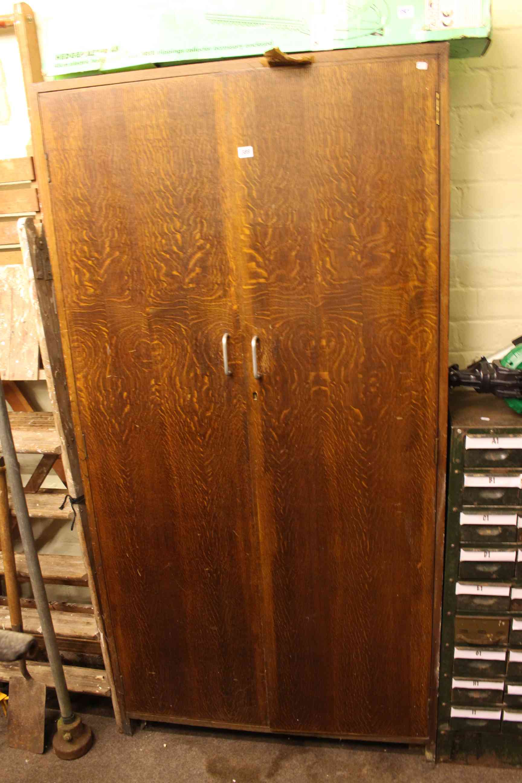 Mid 20th Century oak Post Office two door sorting cupboard fitted with compartments.