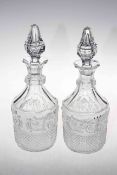 Pair of Baccarat moulded body decanters and stoppers, 32cm high, one ill fitting stopper.