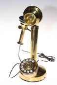 Brass stick design telephone.