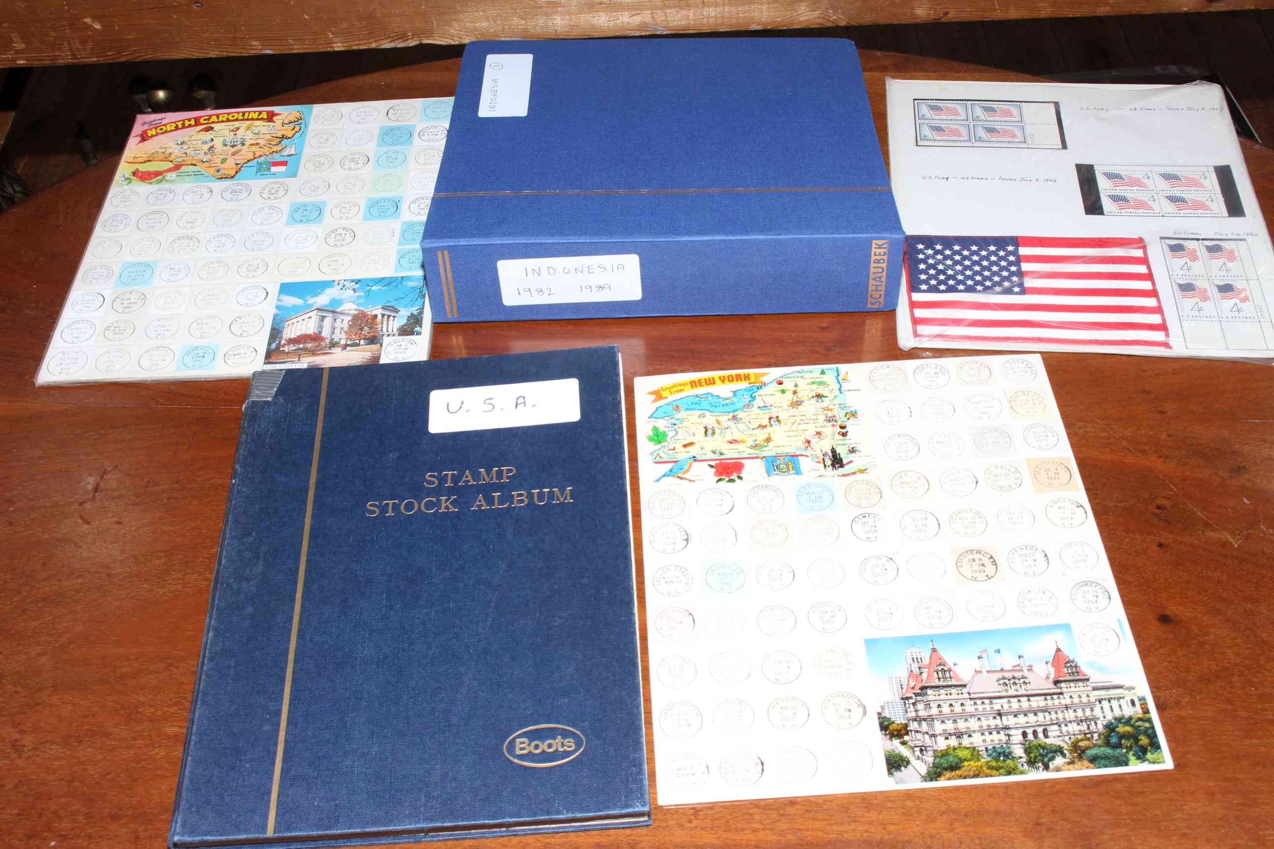 Box of stamp albums containing USA, Indonesian and other stamps. - Image 2 of 2