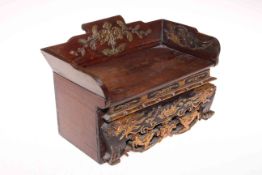 Chinese box in the form of a settle with gilt highlighted carved decoration and secret drawer to