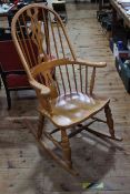 Windsor style pierced splat back rocking chair.