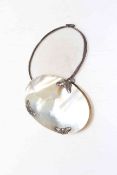 Mother of pearl and silver mounted magnifier, 8cm across.