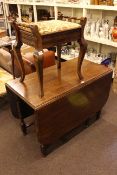 Oak barley twist drop leaf dining table, Edwardian piano stool,