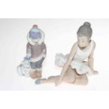 Lladro Eskimo boy with bear cub, 15cm, and Nao ballerina resting. Condition: Both Good.