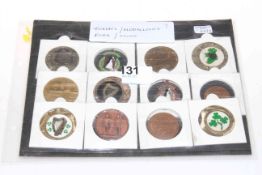 Collection of twelve tokens, coins and medallions.