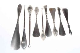 Collection of six silver handled shoe horns and three button hooks (9).