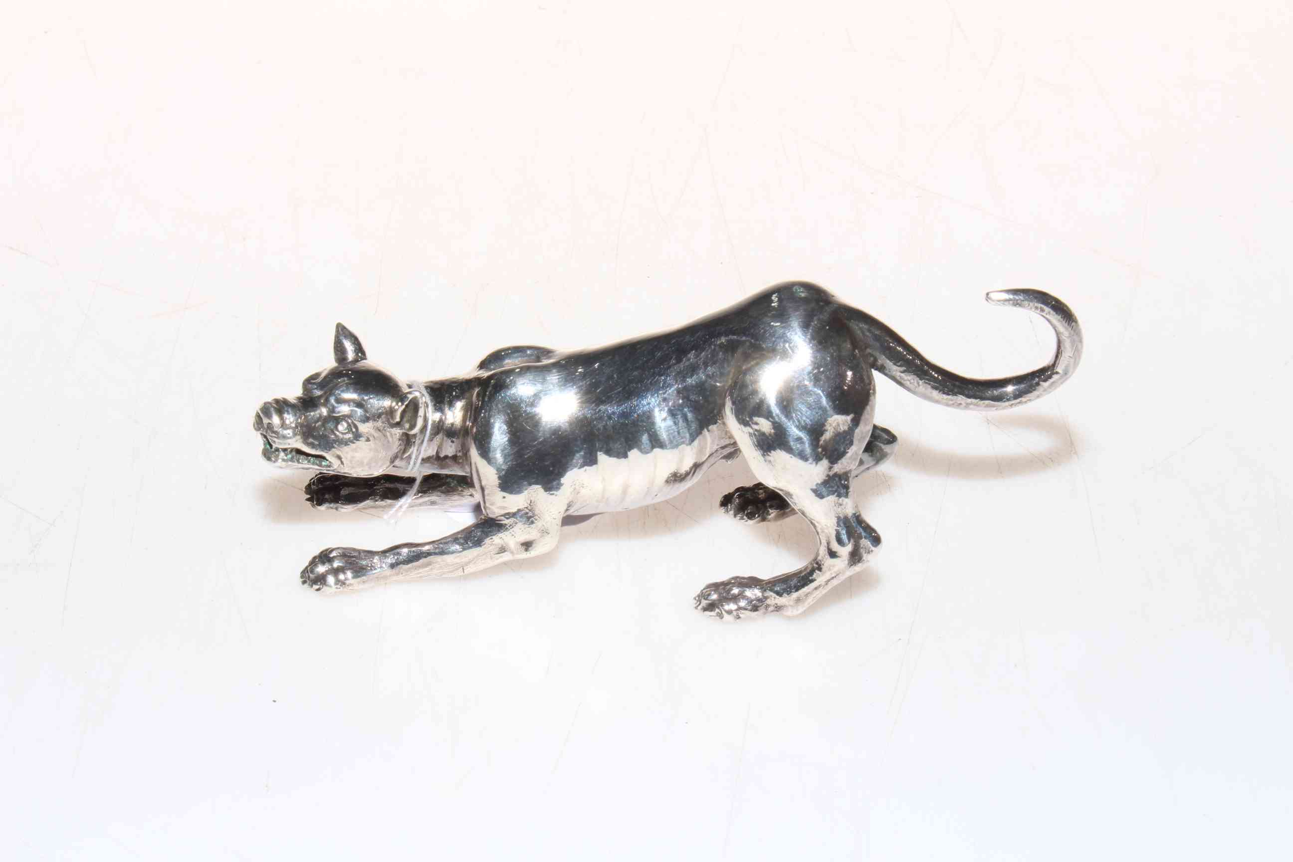 Silver plated model of growling hound, 13cm length.