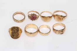 Collection of eight 9 carat gold rings, including one gem set and one very worn half sovereign.