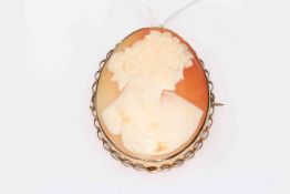 9 carat gold mounted carved cameo brooch with safety chain, 5.75 by 4.5cm.