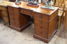 Late 19th/early 20th Century walnut breakfront pedestal desk of nine drawers bearing label for Bell