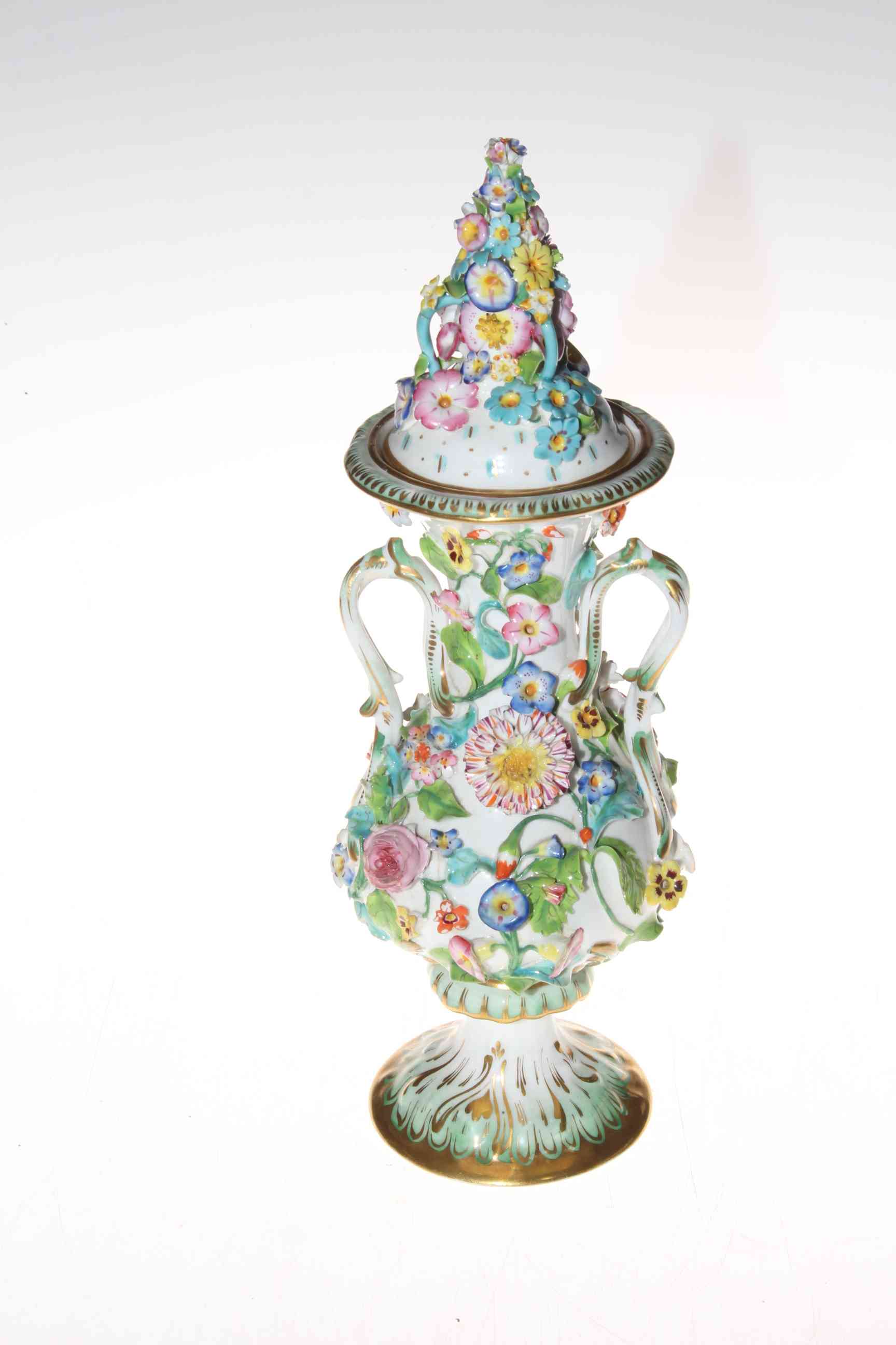 Continental flower encrusted vase and cover, 32cm.