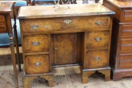 19th Century burr walnut writing desk having frieze drawer above a central inset cupboard flanked