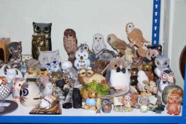 Large collection of owl ornaments, plates, bookends, soft toys, etc.