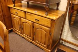 Malaysian light wood eight piece dining suite comprising three door sideboard,