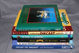 Six Toy collectors reference books.