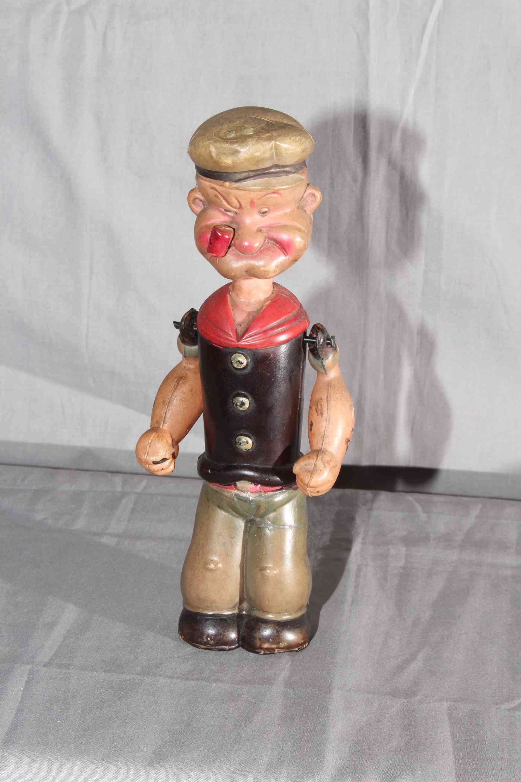 Japanese King Features Syndicates clockwork Celluloid Popeye figure 8” tall.