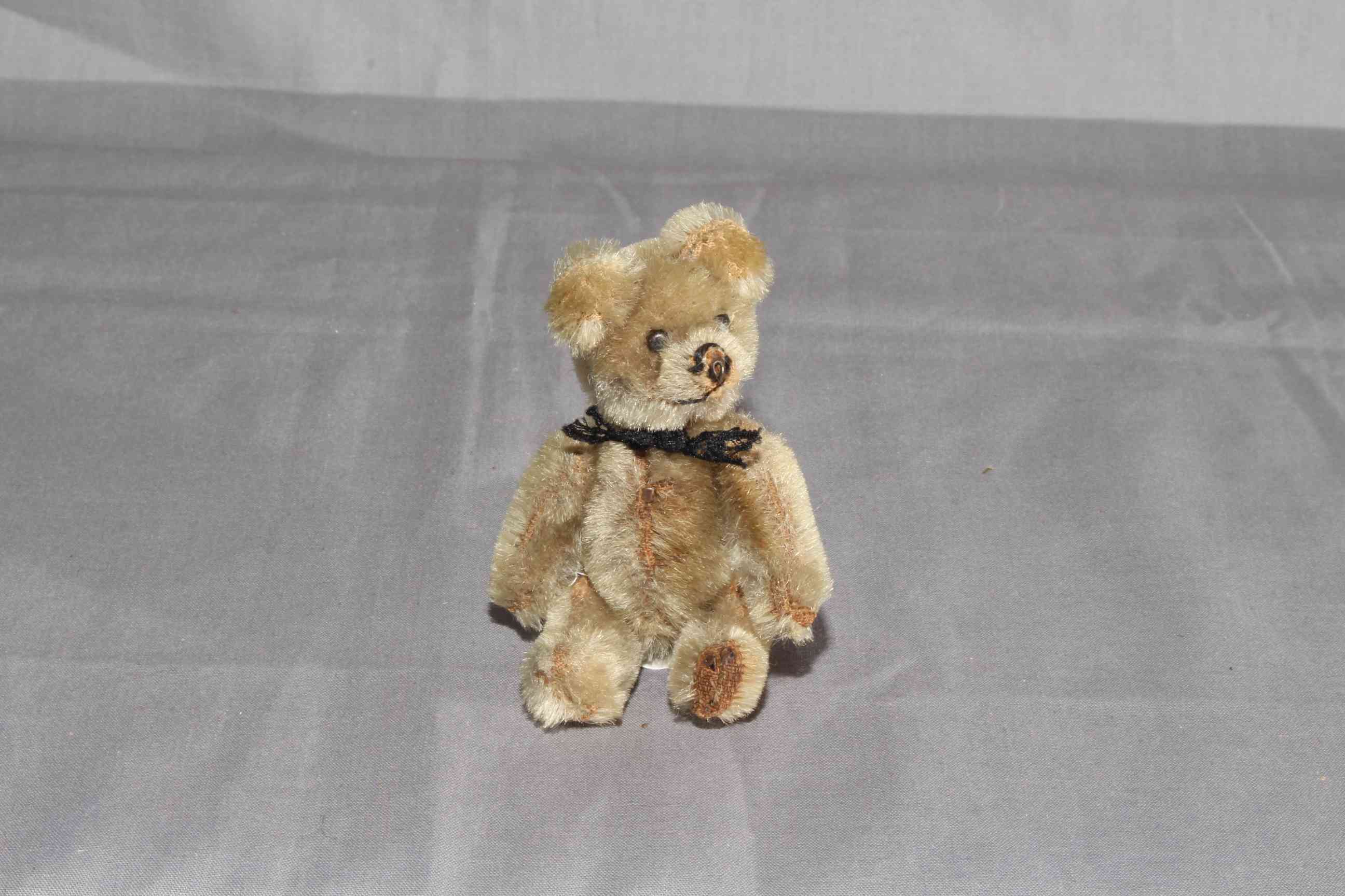 1930s Schuco Jointed Teddy Bear. Mohair with Black Lace Ribbon. Excellent.