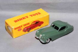 Dinky 157 Jaguar XK120 Coupe with spun hubs. Near Mint in Very Good box with correct colour spot.