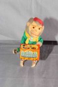 Post War West German clockwork tinplate Monkey playing Barrel Organ.