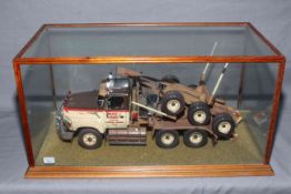 Bruce J. Ramsey & Sons Hobart model logging truck in glazed case.