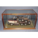 Bruce J. Ramsey & Sons Hobart model logging truck in glazed case.