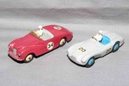 Dinky 107 Sunbeam Alpine and 110 Aston Martin DB3S. Very Good to Excellent unboxed.